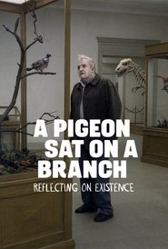Un piccione seduto su un ramo riflette sull'esistenza